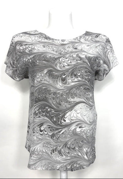 Marbled silk top in soft charcoal and white on a mannequin against a white background