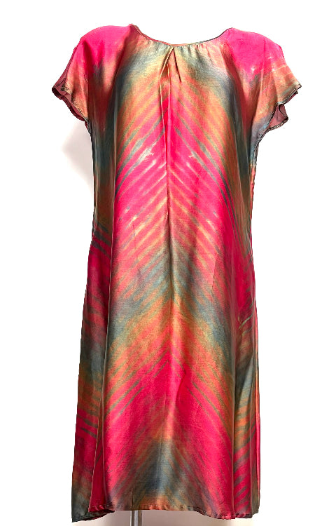 silk satin dress dyed using shibori techniques on a white background