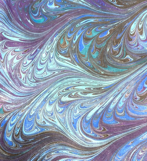 Marbled pattern with swirling colors of purple, blue, and green.