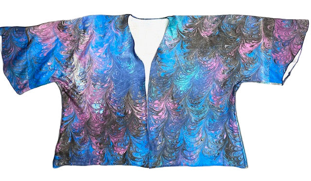 Blue and purple marbled silk sating jacket on a waste background