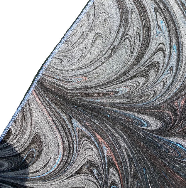 Close-up of marbled silk scarf edge