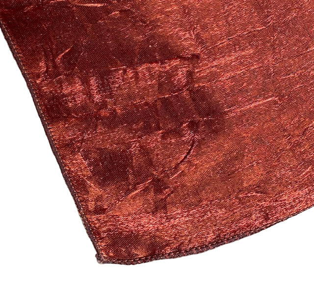 Close-up of the edge os a copper textured scarf wrap 