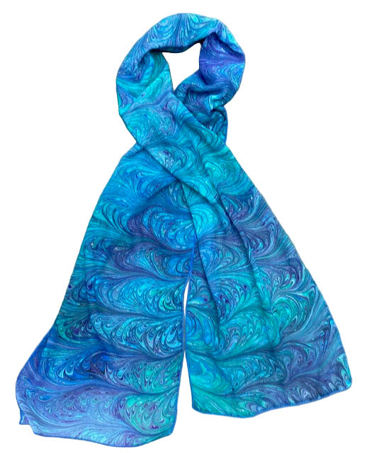Blue and green marbled scarf on a white background