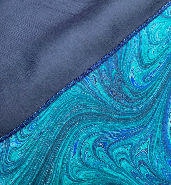 Close-up of stitching between black and marbled chiffon pieces