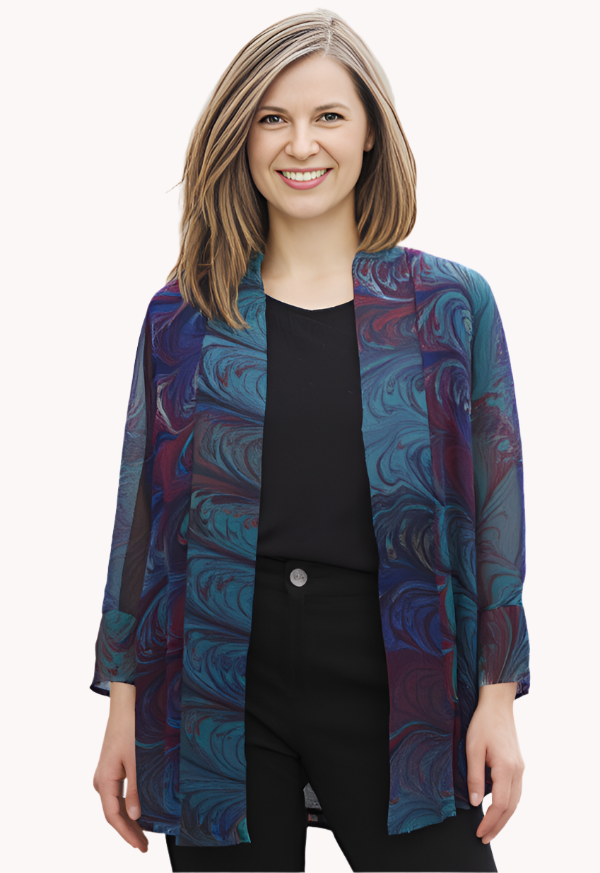 Woman wearing a marbled silk sheer green and  blue  jacket against a white background