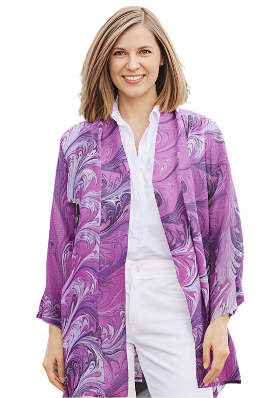 Woman wearing a marbled pink silk kimono over a white shirt and pants