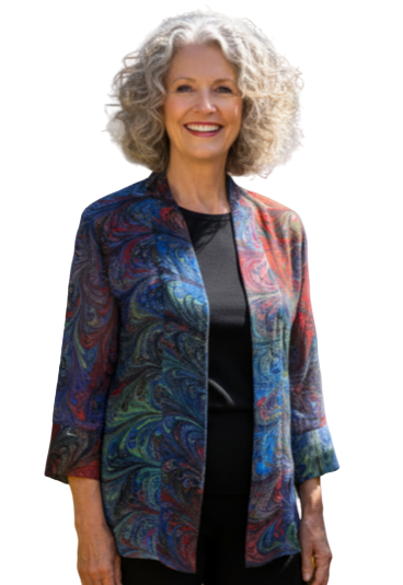 Woman wearing a marbled sheer jackets standing against a white background