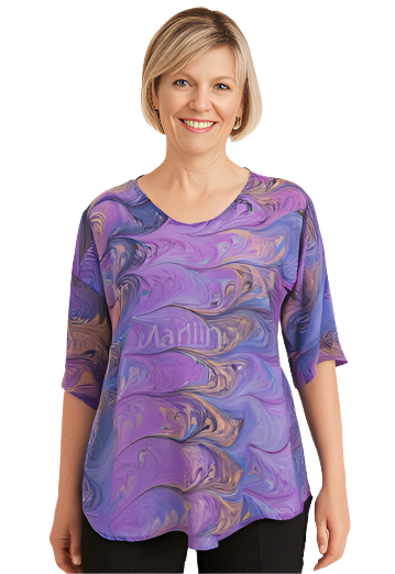 woman wearing a silk top marbled in orchid and peach