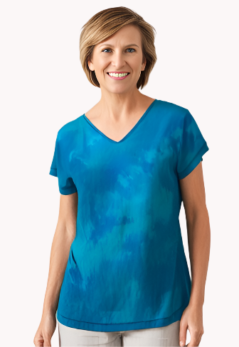 Woman wearing a blue hand dyed silk top and gray pants