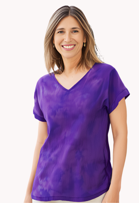 Woman wearing a violet and blue silk tie-dye shirt.