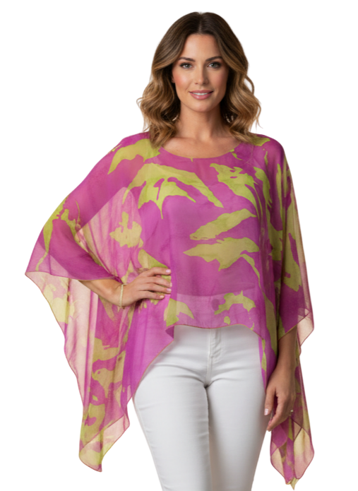 woman wearing pink and lime sheer poncho against neutral background