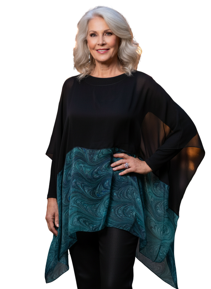 Woman wearing a black and marbled emeralds poncho