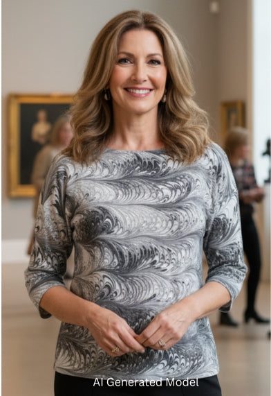 Woman wearing a hand marbled black and white half sleeve silk top 