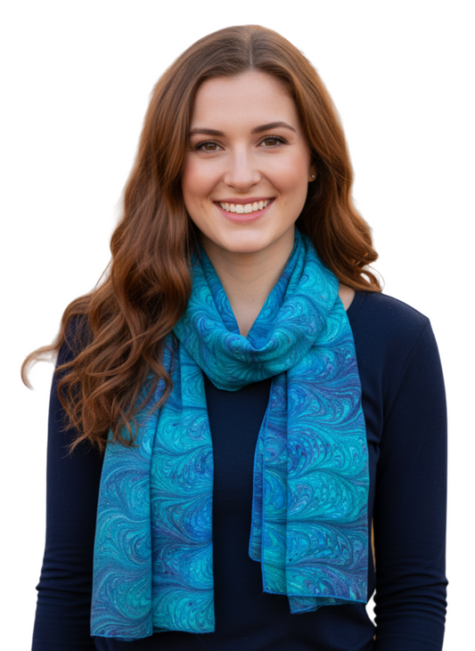 Woman wearing a marbled silk  blue scarf 
