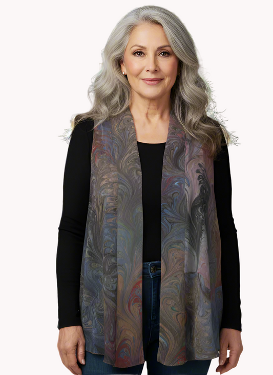 Woman wearing a marbled silk vest outdoors with blurred background