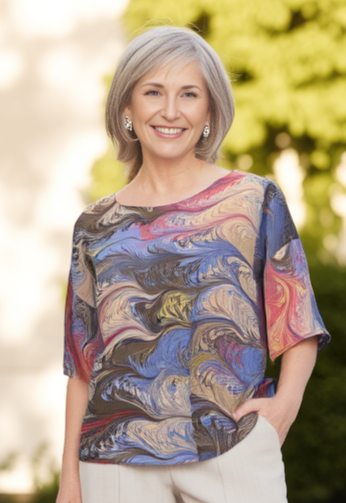 woman wearing a marbled silk top in an outdoor setting