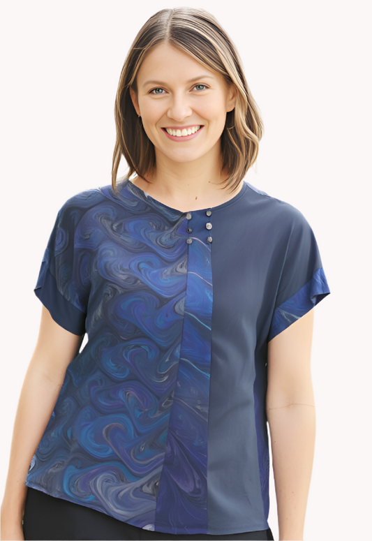 Woman wearing a gray hand dyed  blouse with a marbled inset