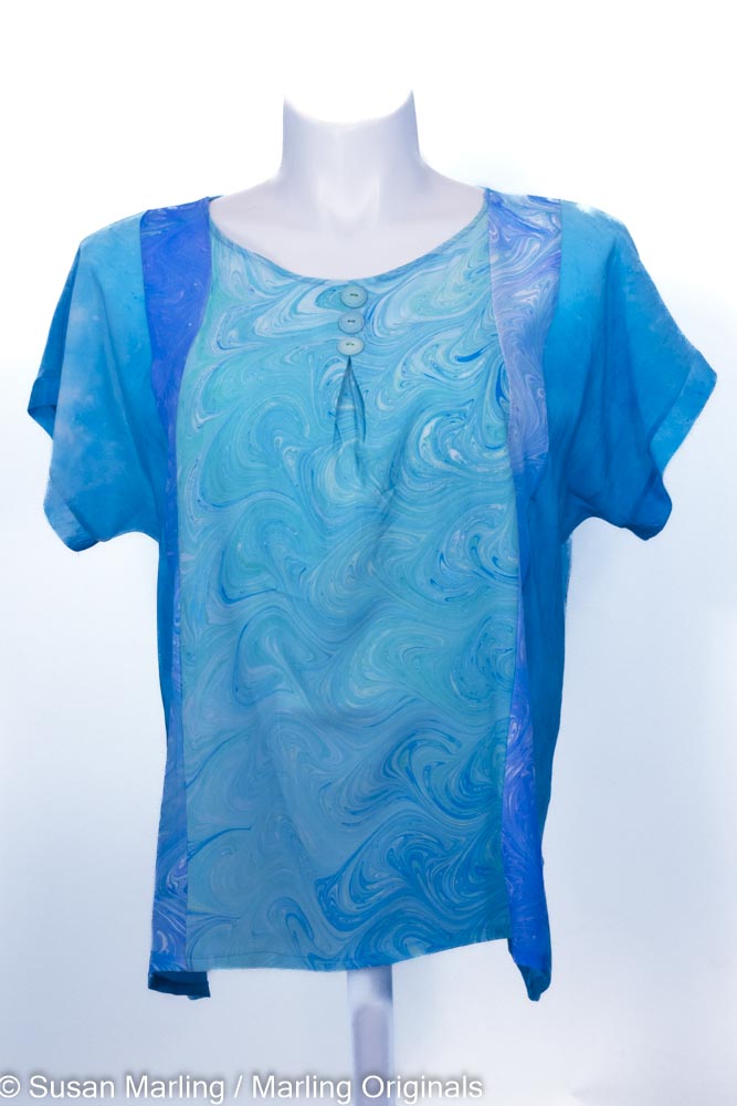 turquoise silk top with marbled aqua front. Short sleeves. Round neck