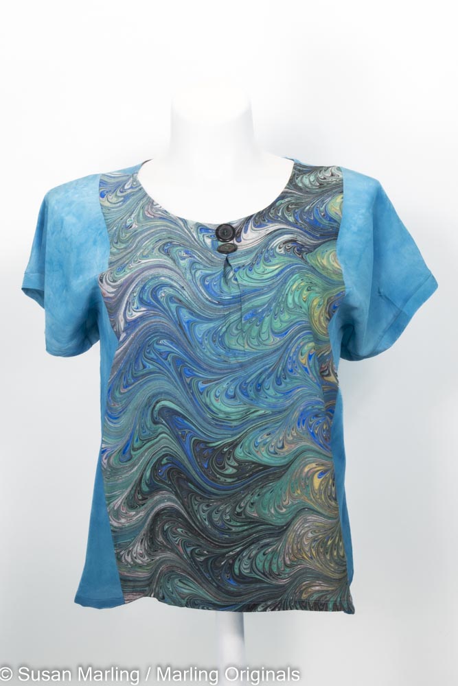 medium jade silk blouse with vibrant marbled inset.  round neck. short sleeves