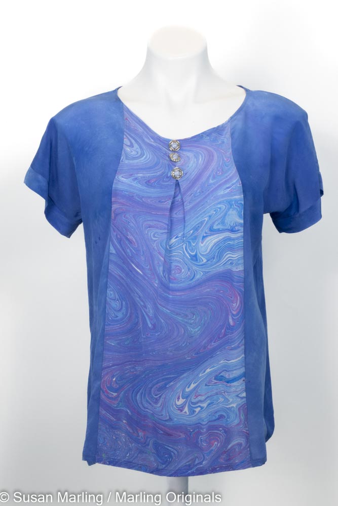 blue silk top with marbled inset front, round neck and short sleeves