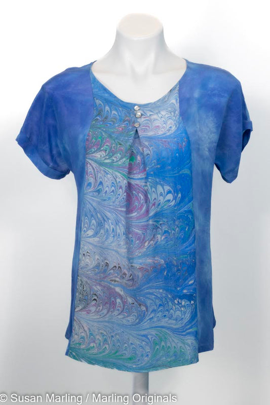 blue silk shirt with marbled inset in front center. Short sleeves. Round neck