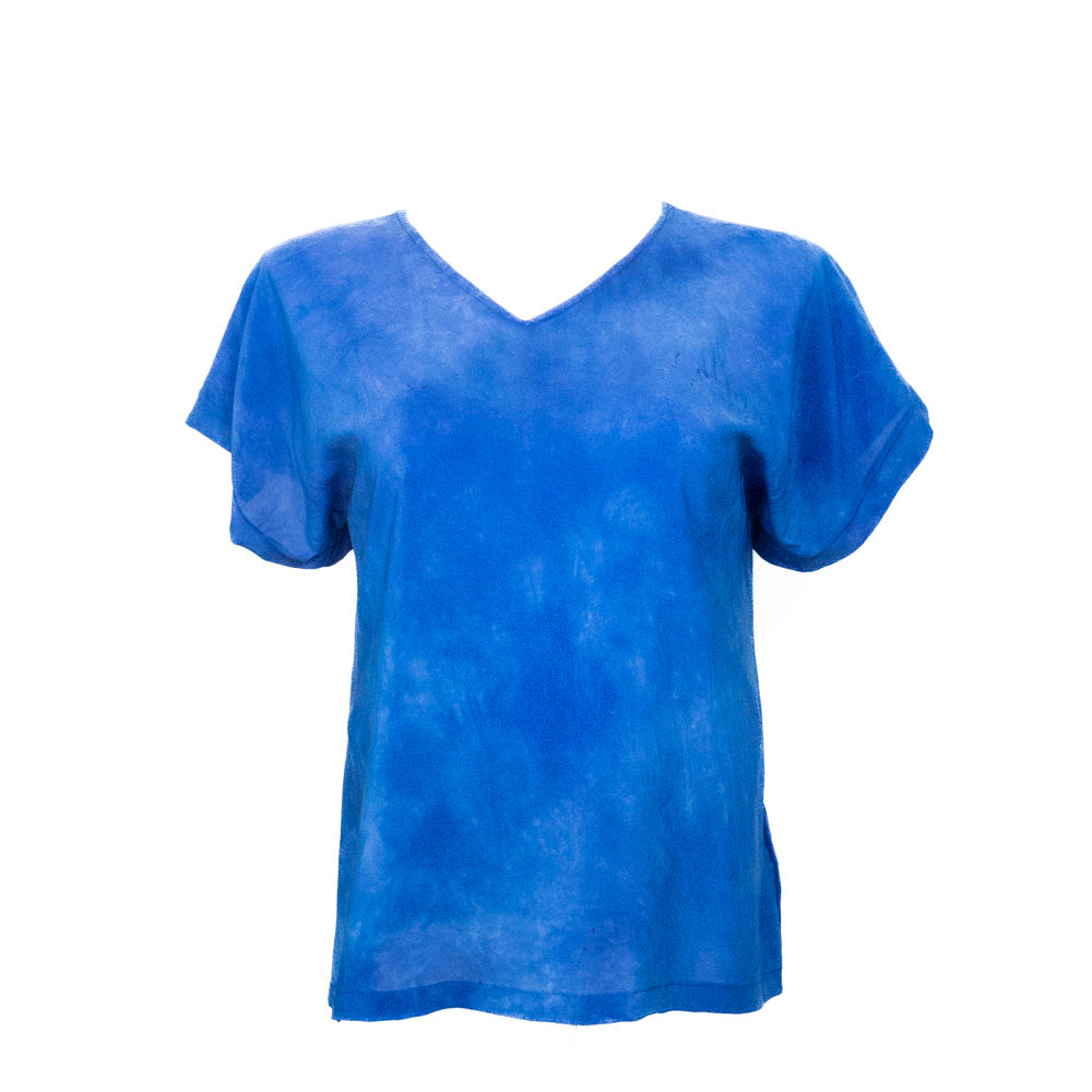Blue hand dyed silk t-shirt on a white background