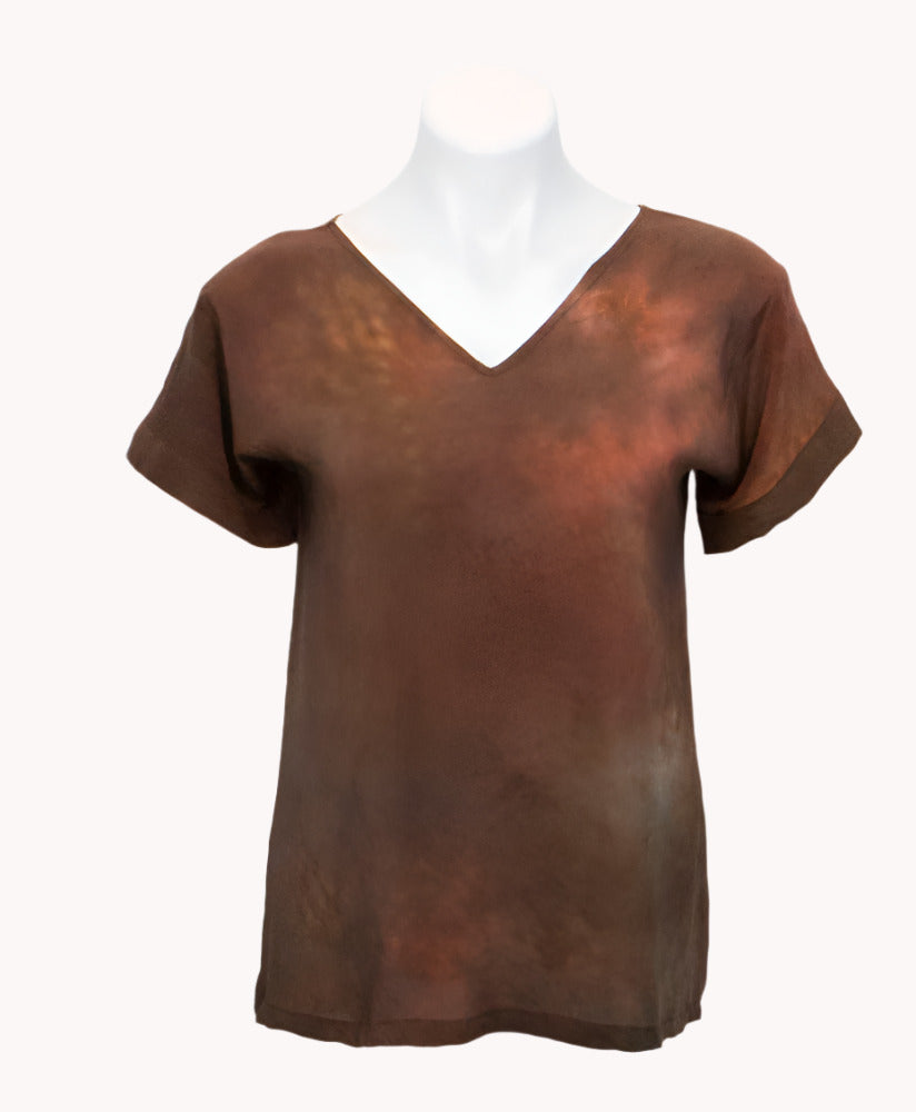 Brown silk hand dyed t-shirt on a mannequin against a white background