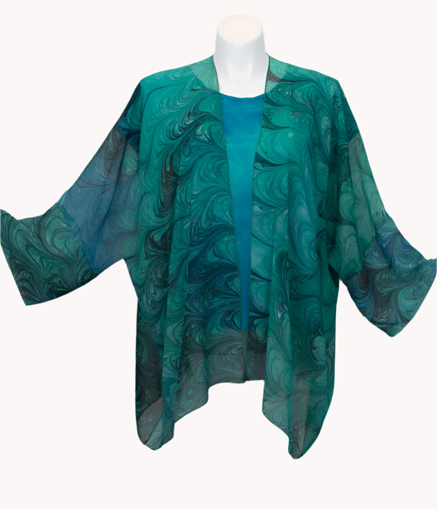 Green marbled sheer wrap/jacket on a mannequin against a white background
