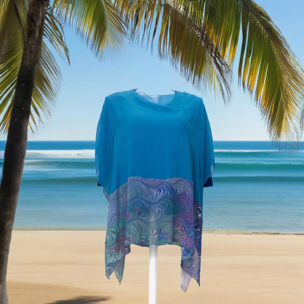 picture of a silk poncho on a beach