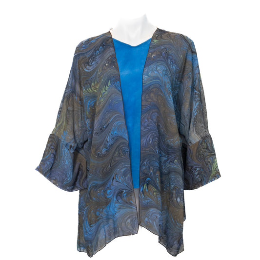 Mannequin wearing a blue and brown hand marbled patterned kimono-style jacket on a white background