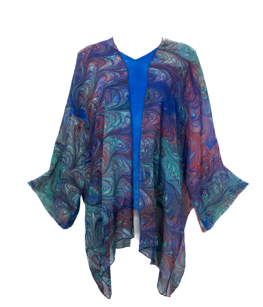 Colorful hand marbled kimono-style garment on a white background