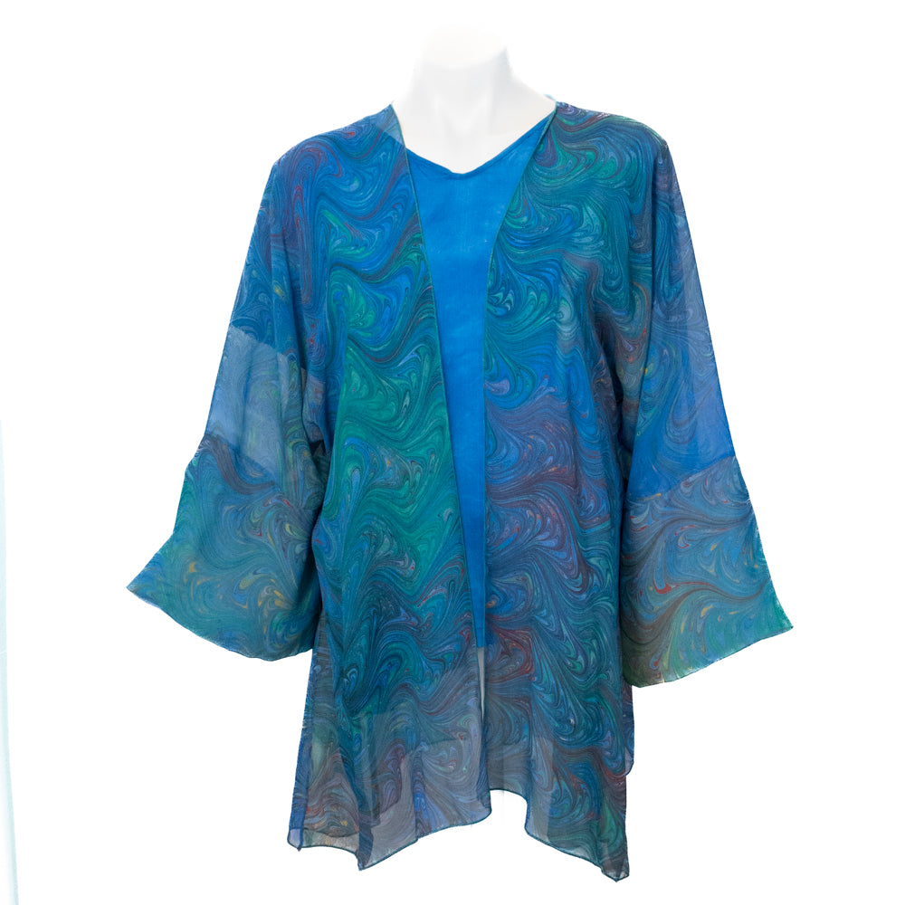Marbled, silk sheer wrap jacket against a white background