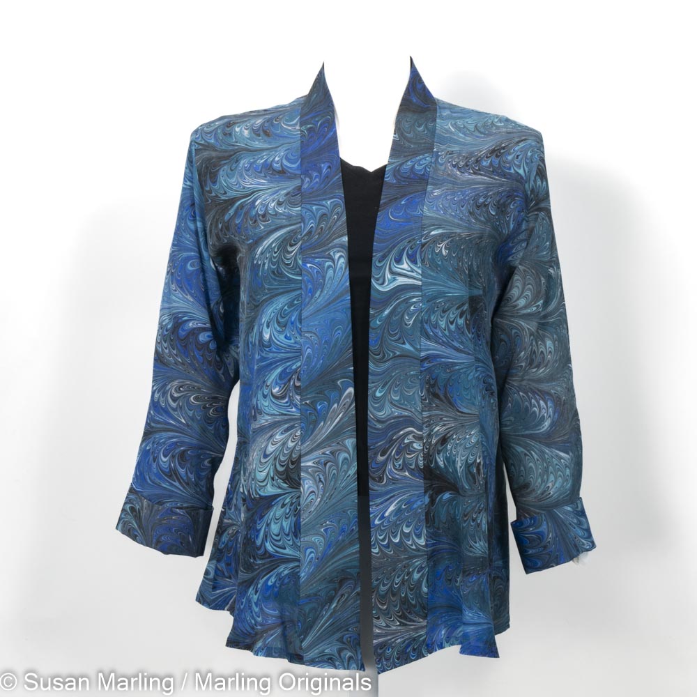 oversized silk swing jacket marbled in blues, teals, black and white.