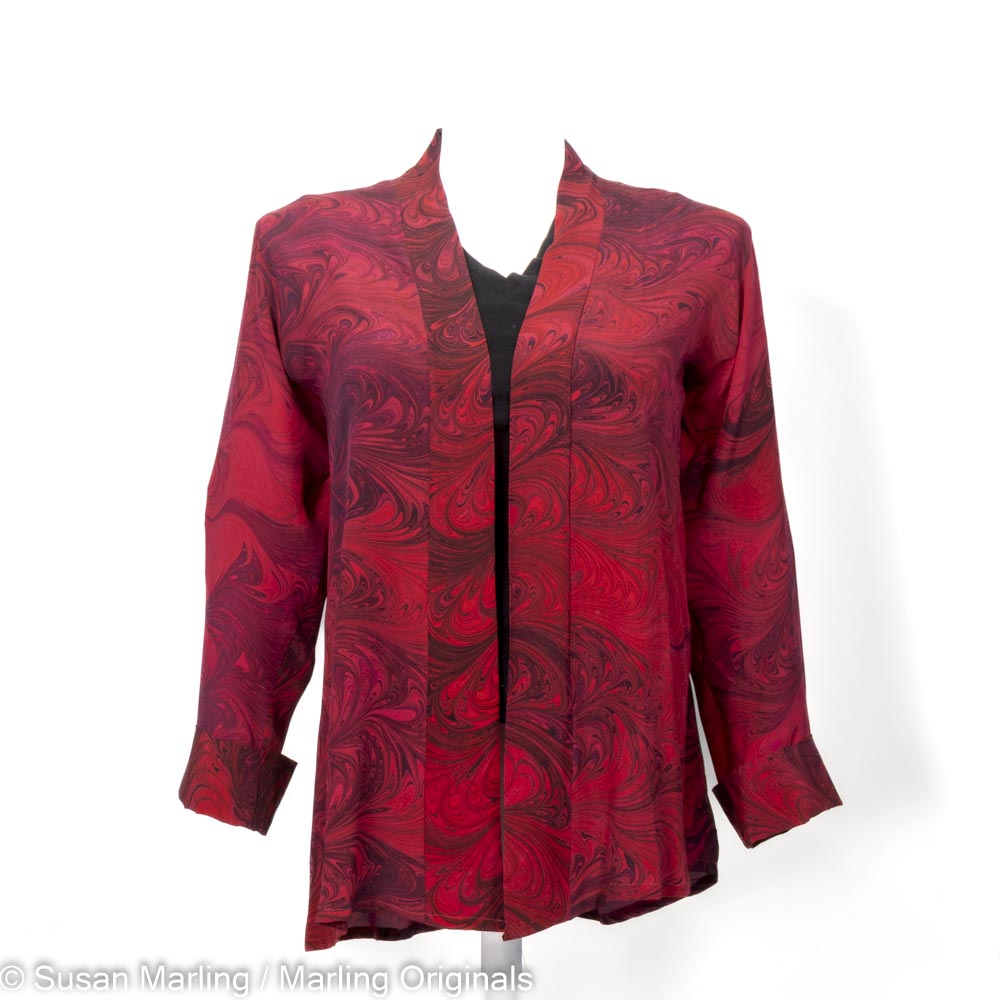 oversized silk swing jacket marbled in a distinctive feathered pattern.  Red and black.