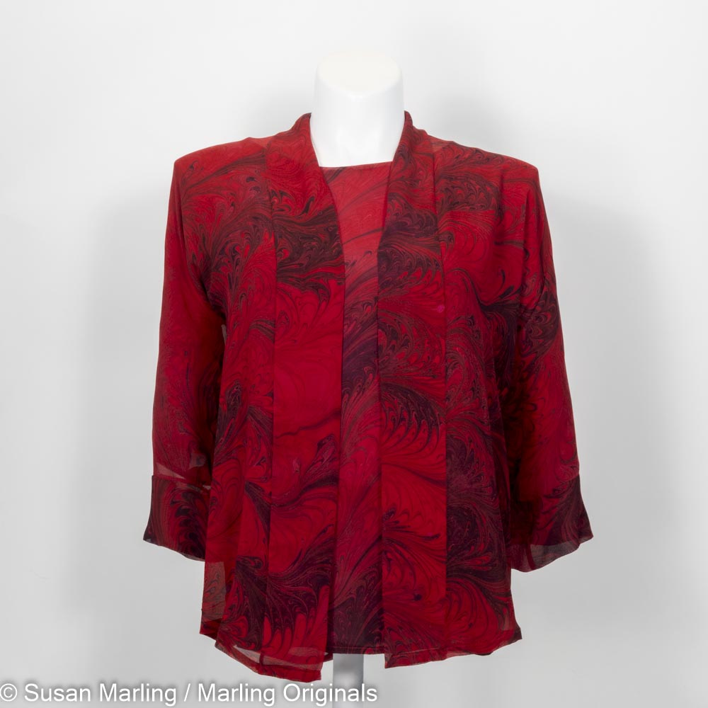 marbled silk blouse paired with sheer kimono jacket in red and black feathered pattern