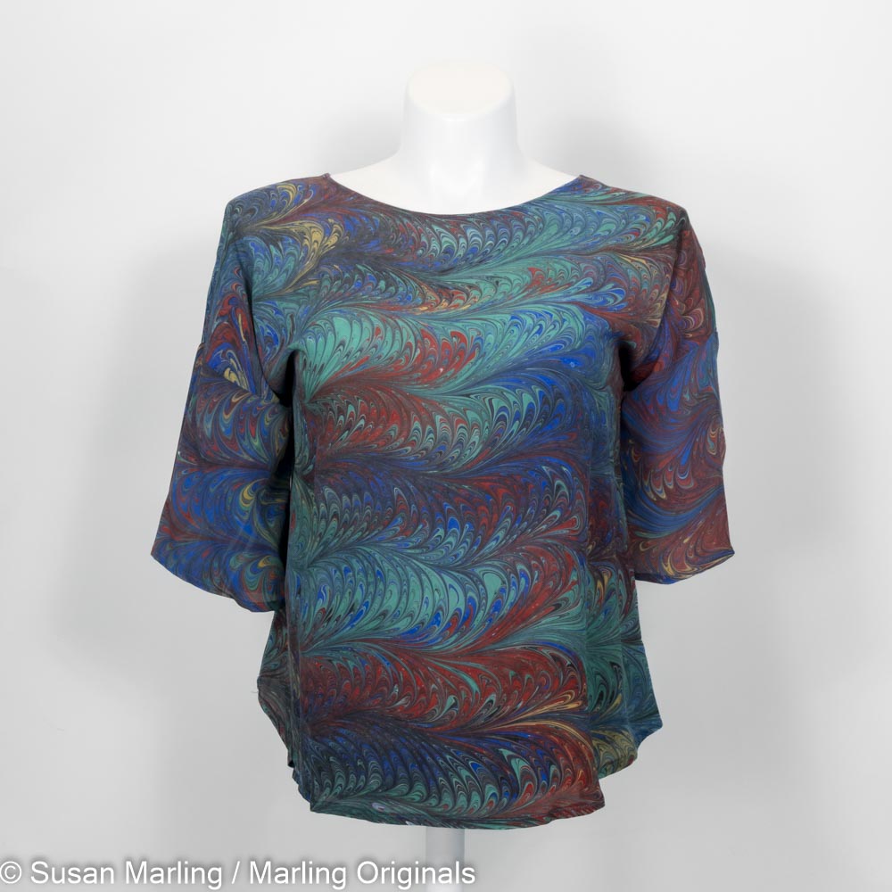 marbled silk top with round neck, half sleeve in marbled pattern of blue, red, yellow