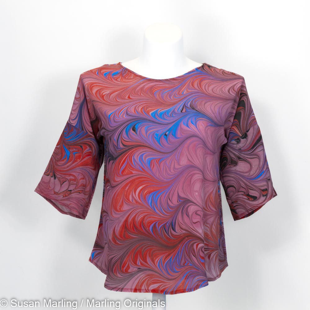 silk blouse with marbled pattern in mauves with red and blue. Half sleeves with round neck