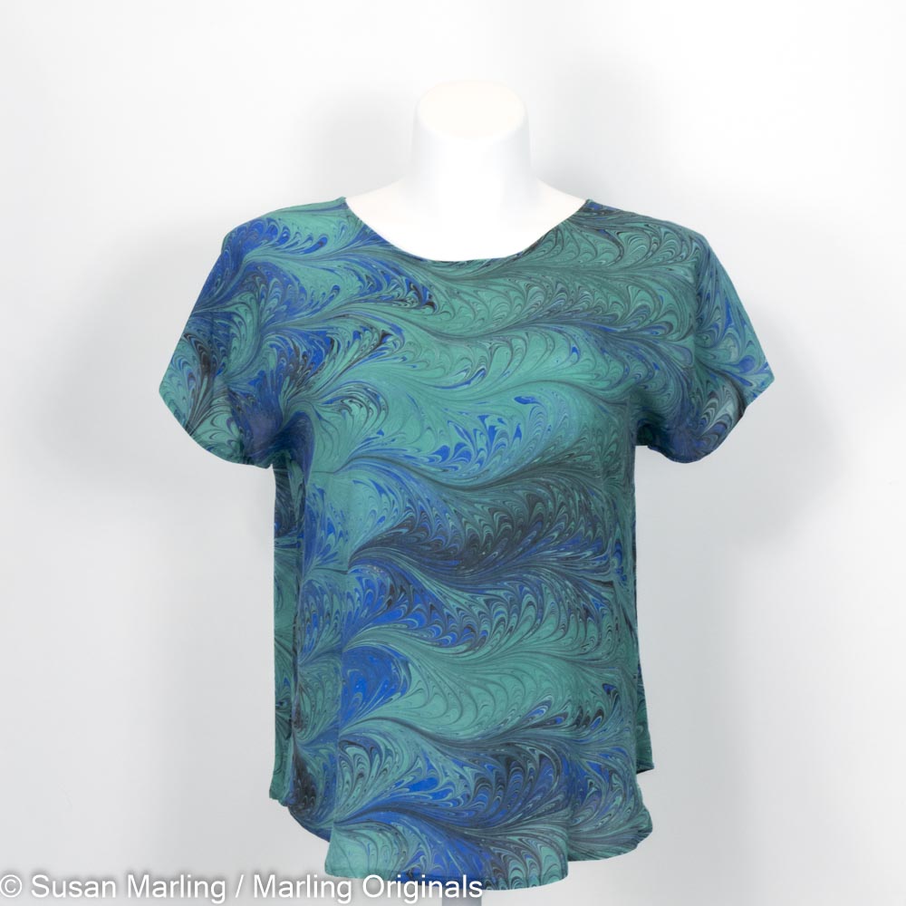 short sleeve blouse marbled in a feathery pattern in emerald, teal and blue