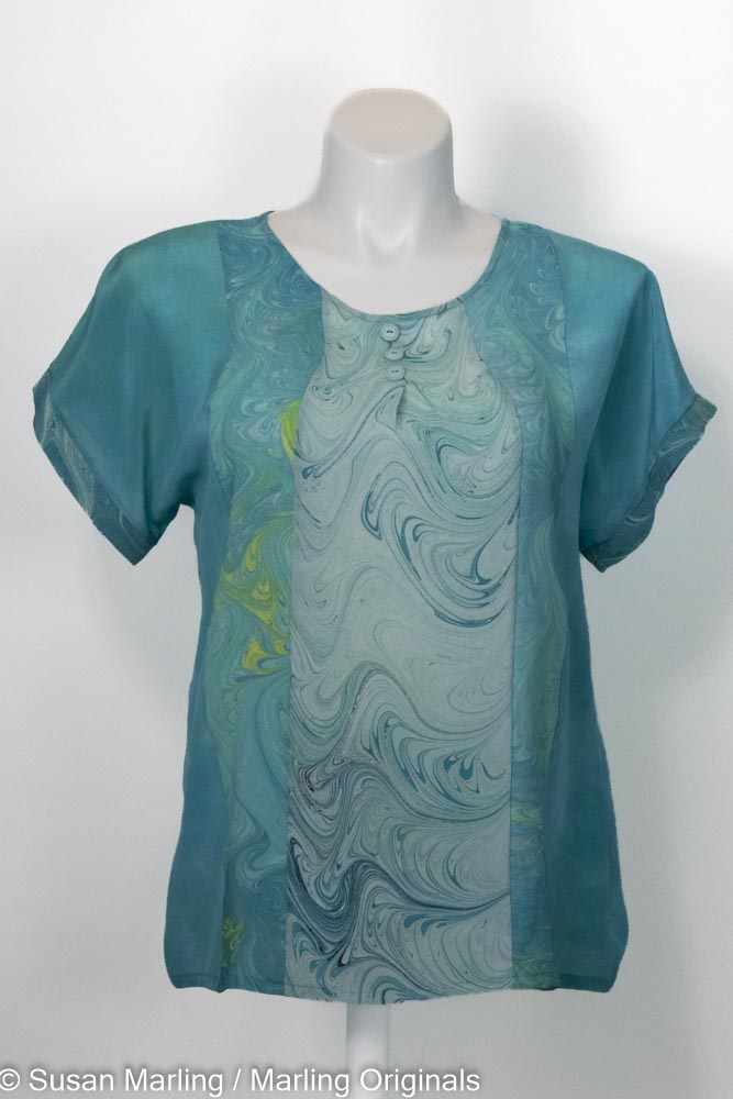 Dyed silk blouse in rich jade tone with marbled silk inset in turquoise and white.