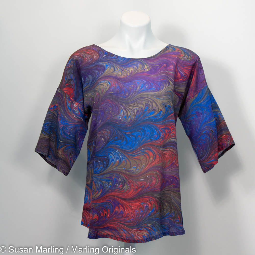 Silk round neck blouse with half sleeves.  Marbled in rich blue, purple, brown and red.