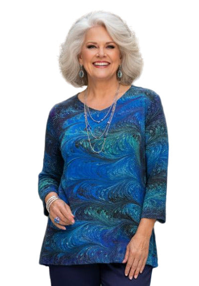 Woman wearing a blue hand marbled silk tunic 