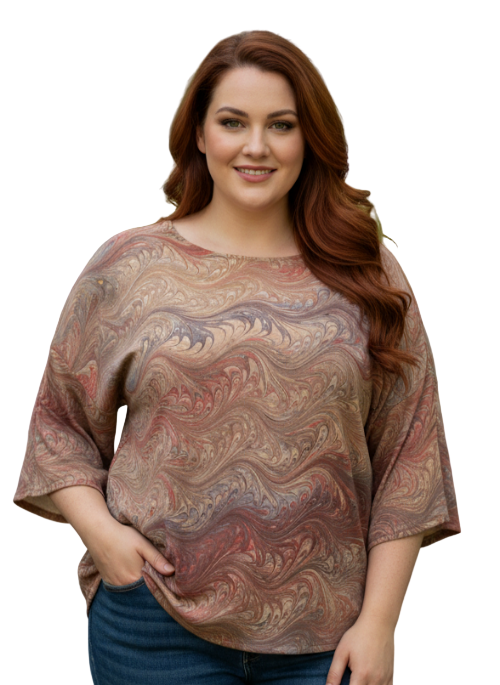 Woman wearing a patterned top on a white background