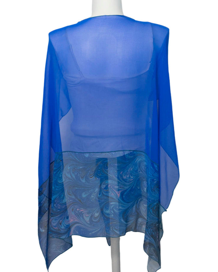 back of Blue sheer top on a mannequin against a white background