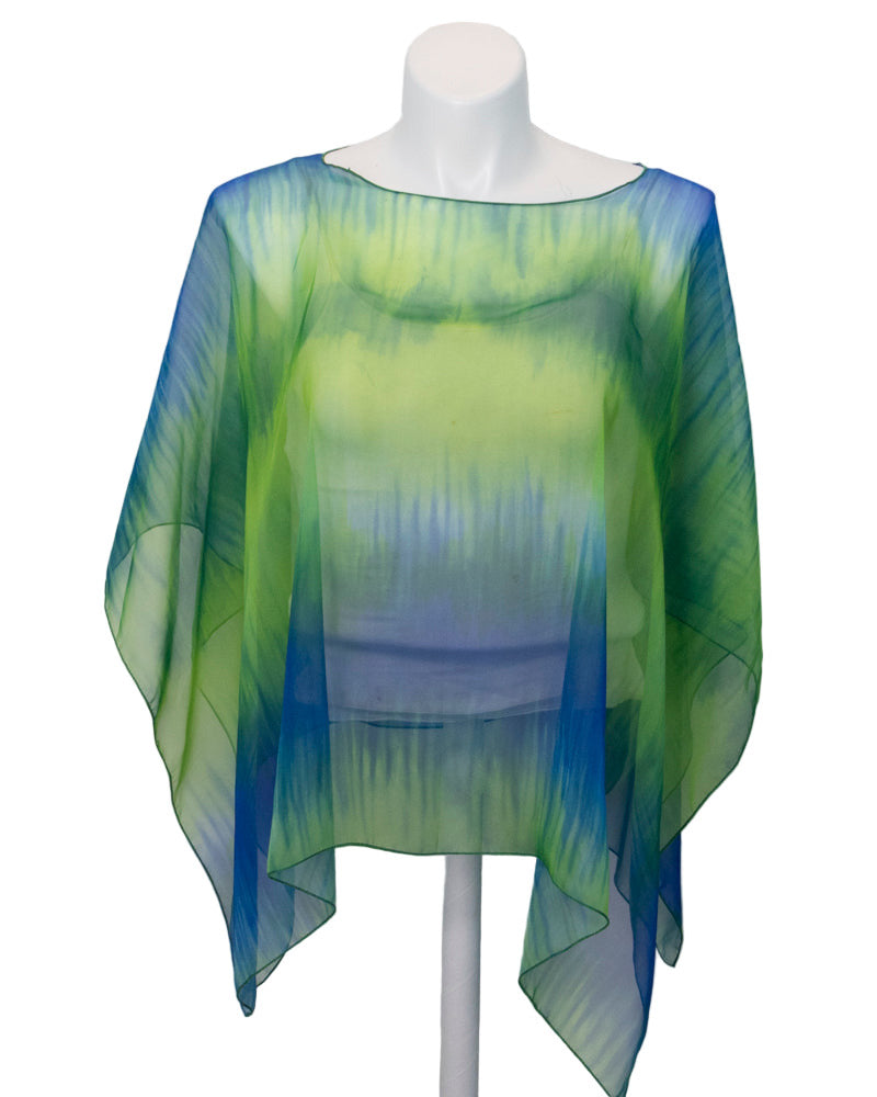 Sheer green and blue poncho on a mannequin against a white background