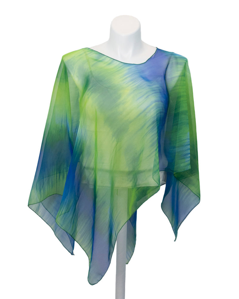 Sheer green and blue poncho on a mannequin against a white background