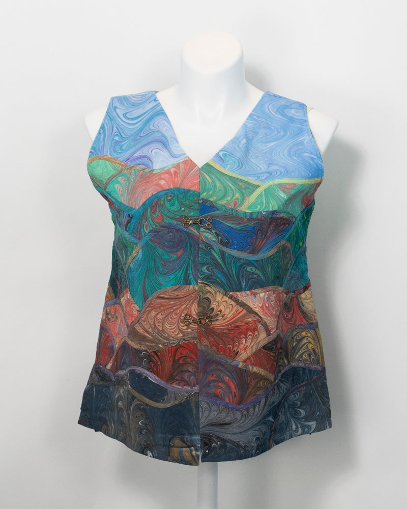 Front of a marbled silk art vest on a mannequin