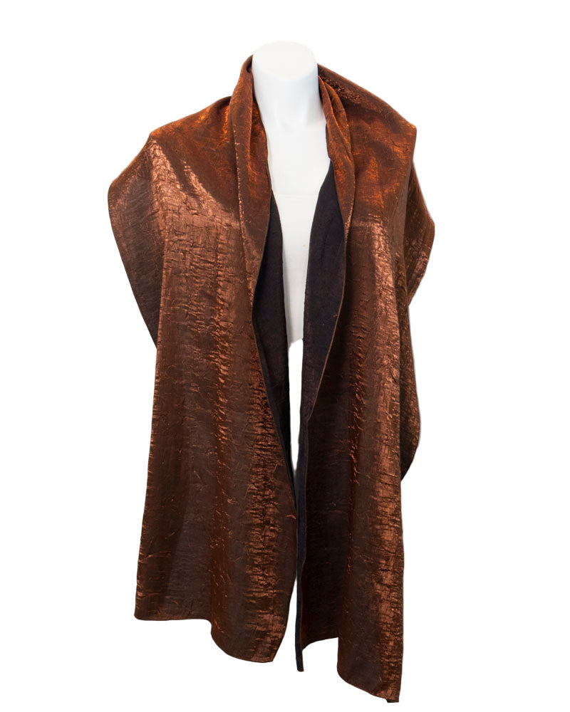 Brown textured scarf on a mannequin against a white background