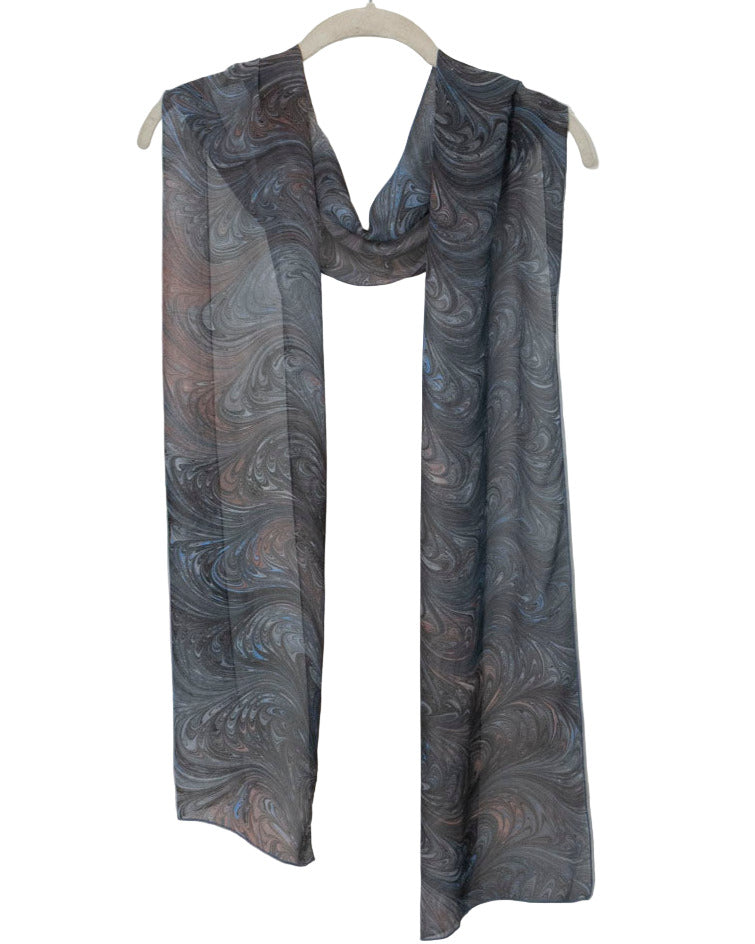Gray marbled silk scarf scarf on a white hanger against a white background