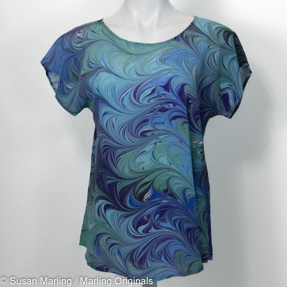 silk top with short sleeves hand marbled in blues, teals