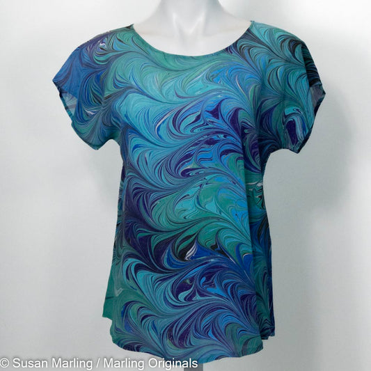 silk top with short sleeves hand marbled in blues, teals